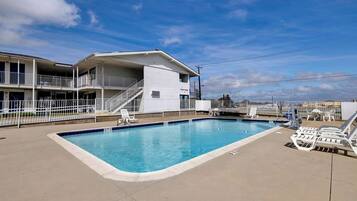 Outdoor pool, open 9:30 AM to 9:30 PM, pool loungers