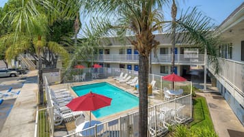 Outdoor pool, open 9:00 AM to 9:00 PM, pool umbrellas, sun loungers