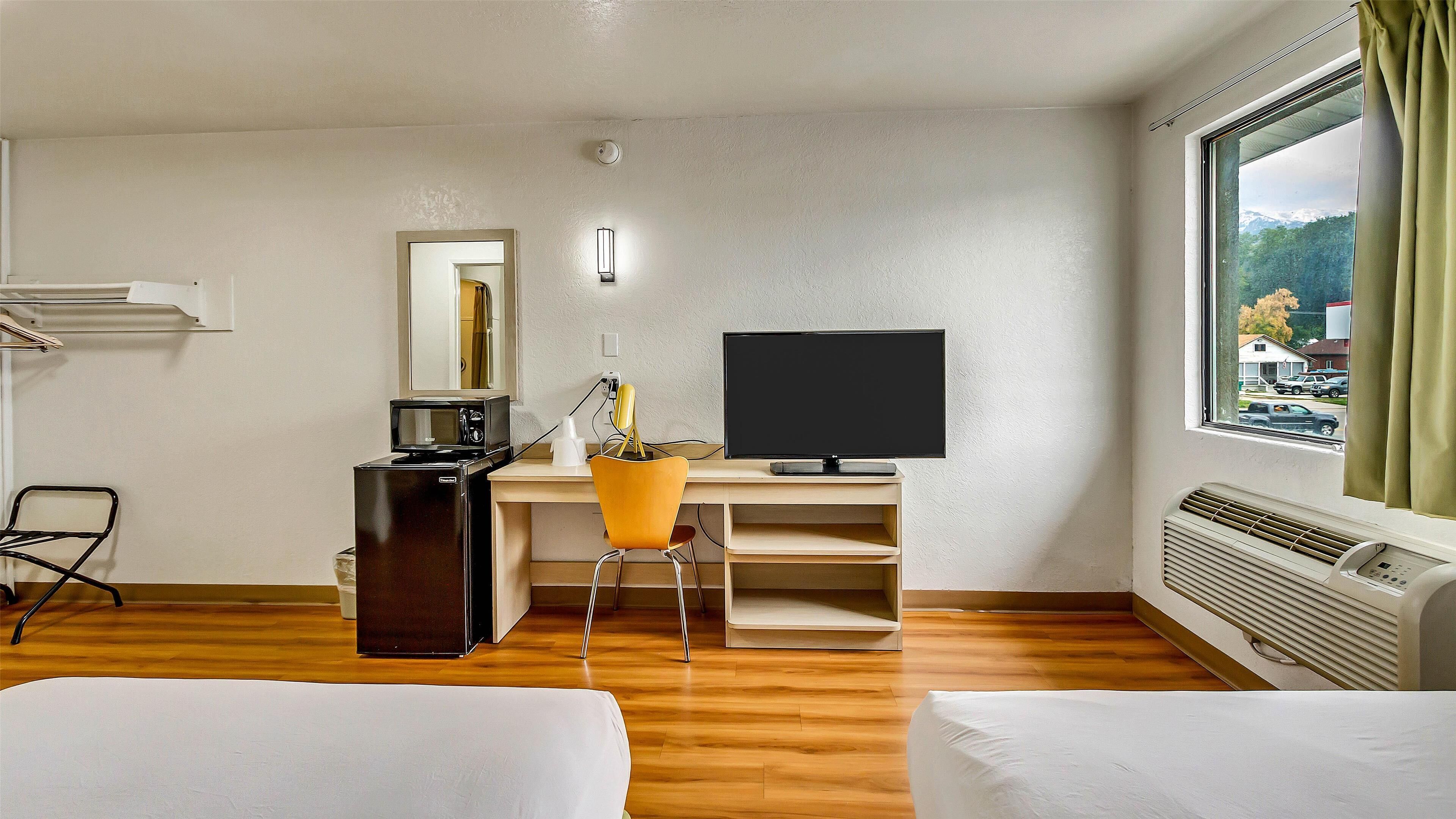 Individually furnished, desk, laptop workspace, blackout drapes