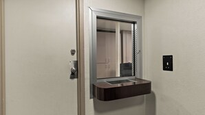 A bathroom with a mirror, a sink, and a towel rack. - Red Roof Inn Spartanburg - I-85 (Spartanburg)
