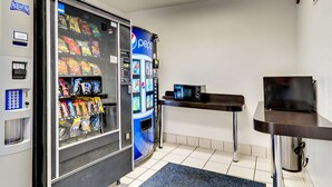 A vending machine area with a Pepsi cooler and an Aquafina water dispenser. - Motel 6 Linthicum Heights, MD - BWI Airport (Linthicum Heights)