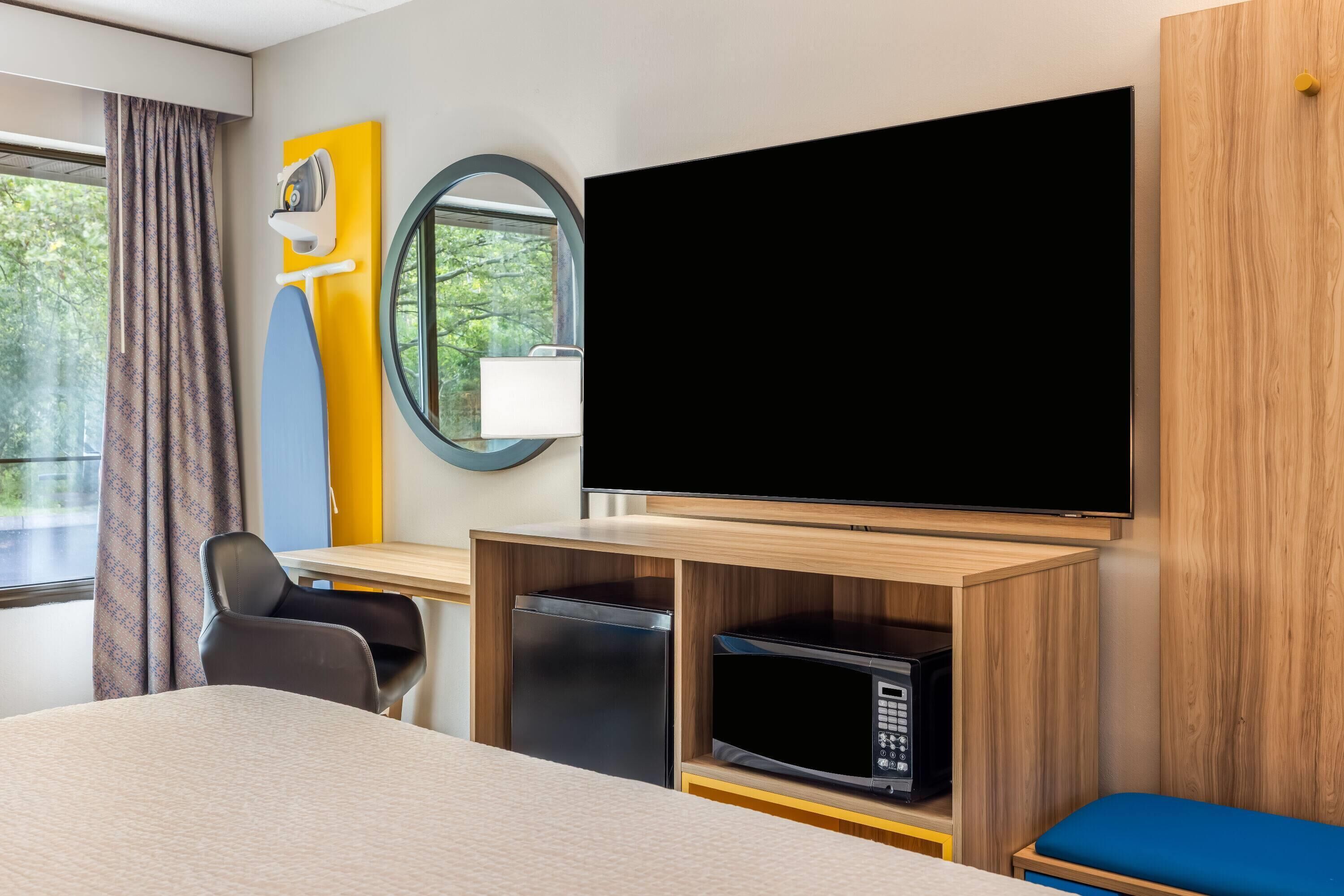 Desk, laptop workspace, blackout curtains, iron/ironing board