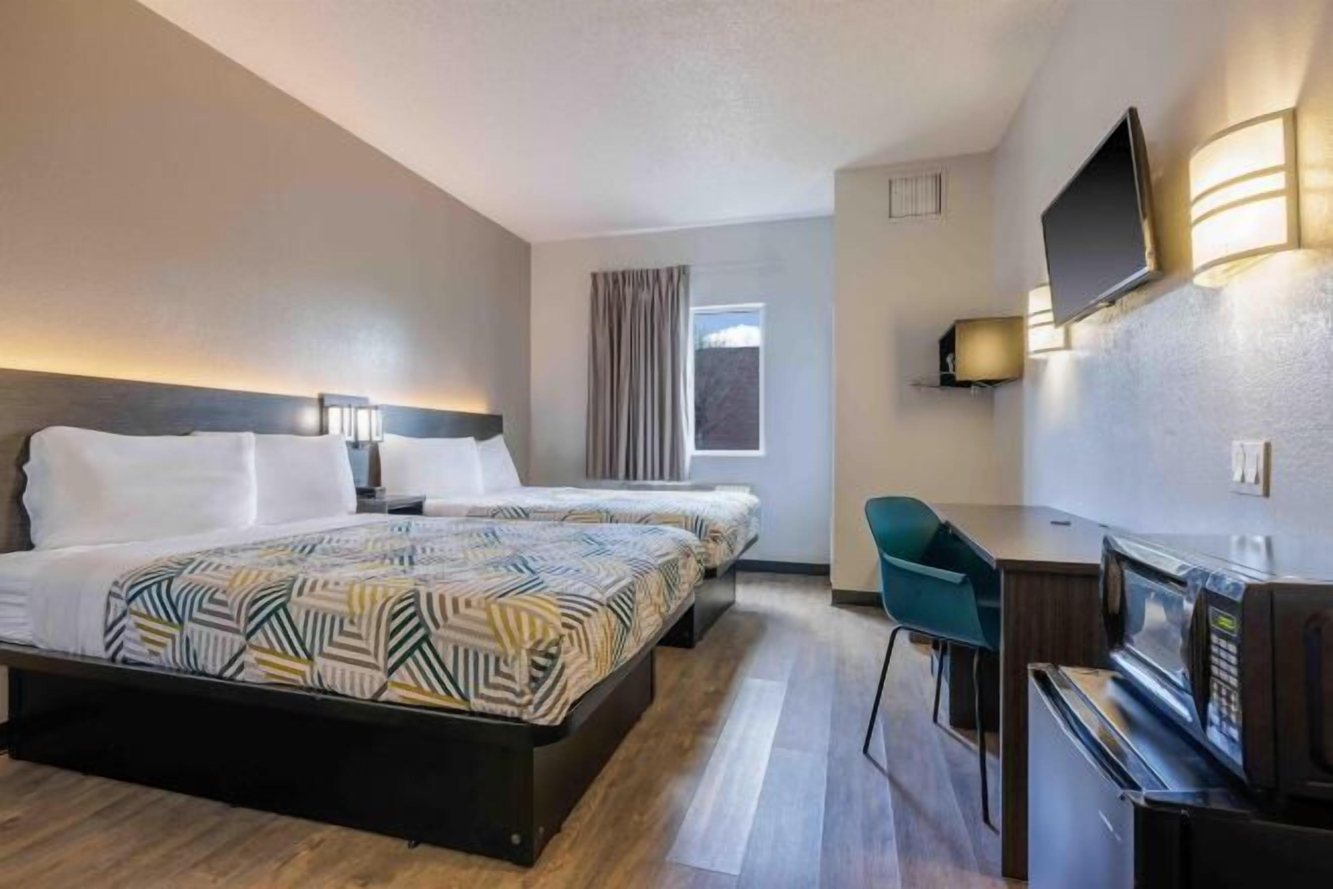 Desk, laptop workspace, blackout curtains, free WiFi