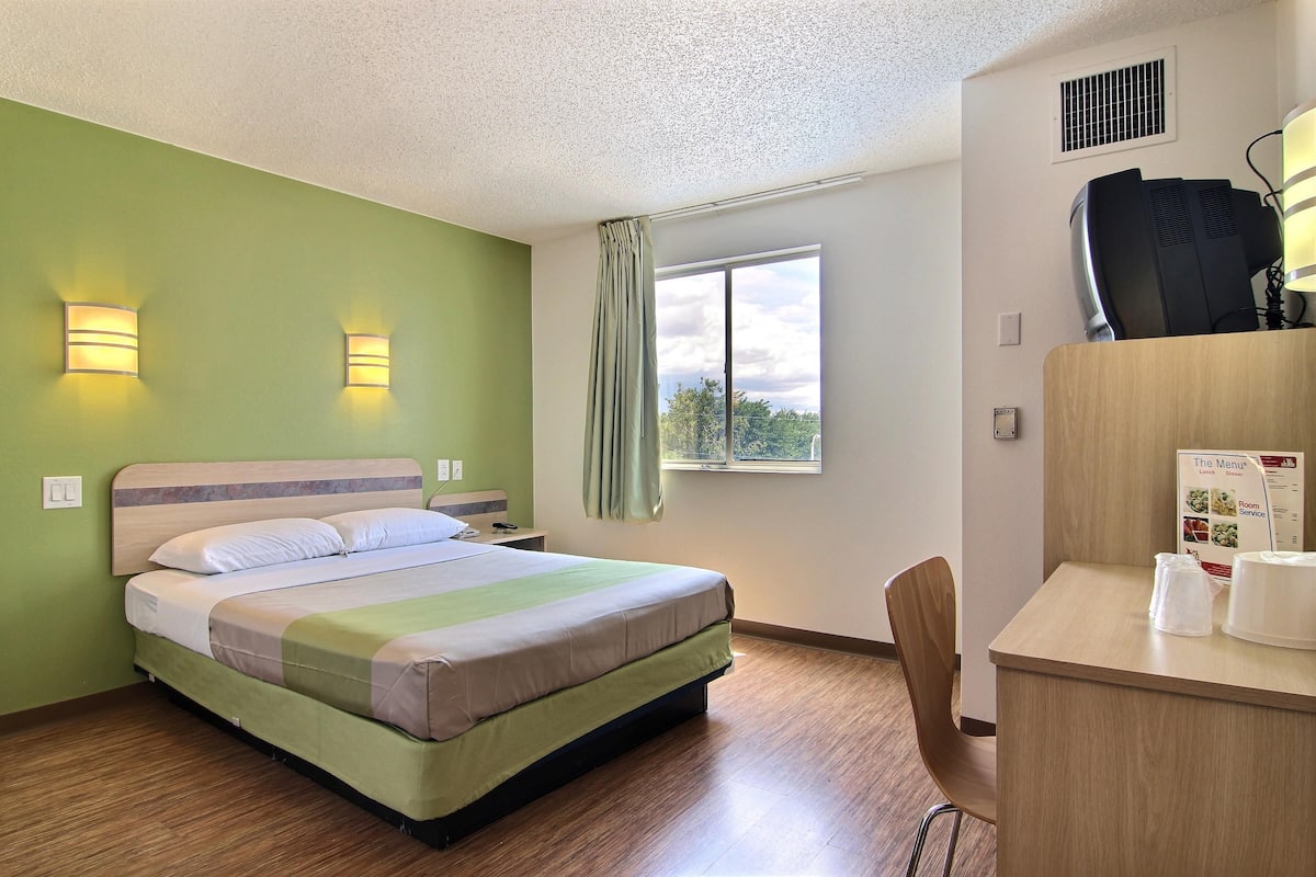 Desk, laptop workspace, blackout curtains, free WiFi