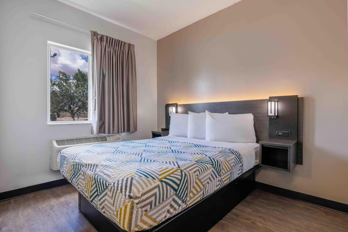 Desk, laptop workspace, blackout curtains, free WiFi