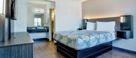 Desk, laptop workspace, blackout drapes, iron/ironing board