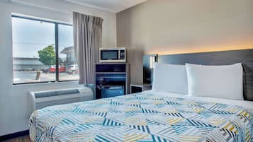 Desk, laptop workspace, blackout curtains, iron/ironing board