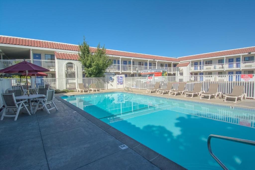 Seasonal outdoor pool, pool umbrellas, pool loungers