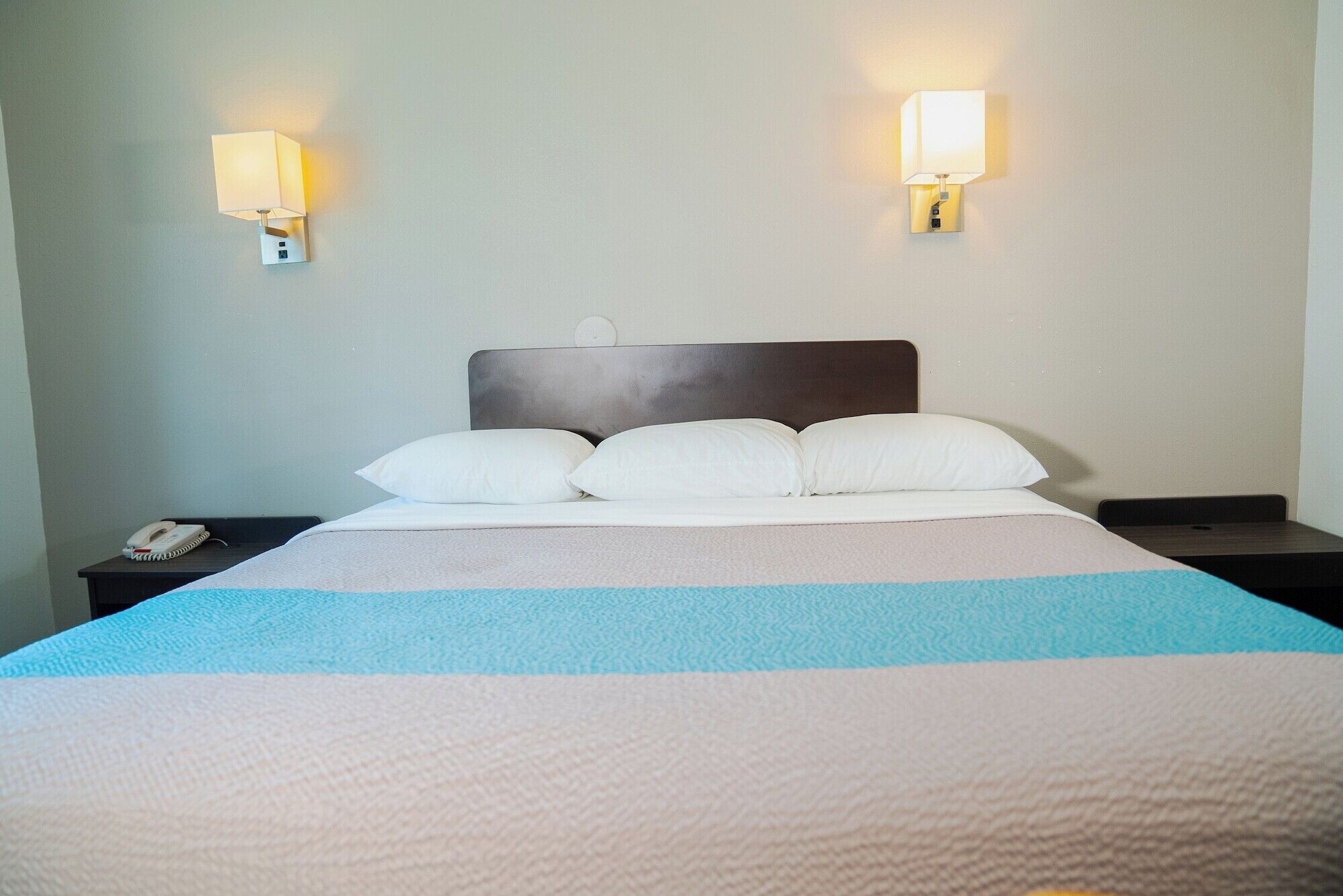Desk, laptop workspace, bed sheets