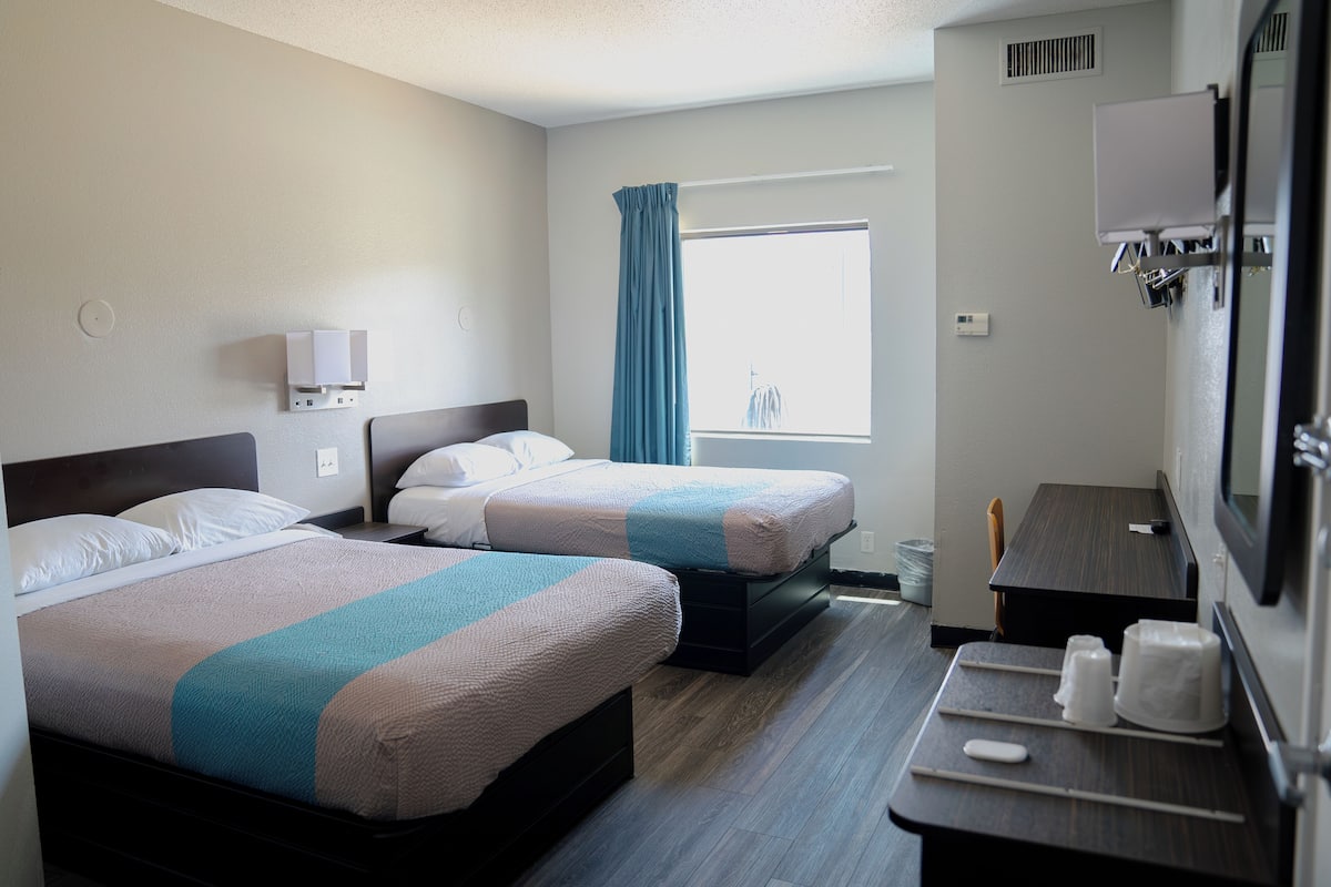 1 bedroom, desk, laptop workspace, bed sheets