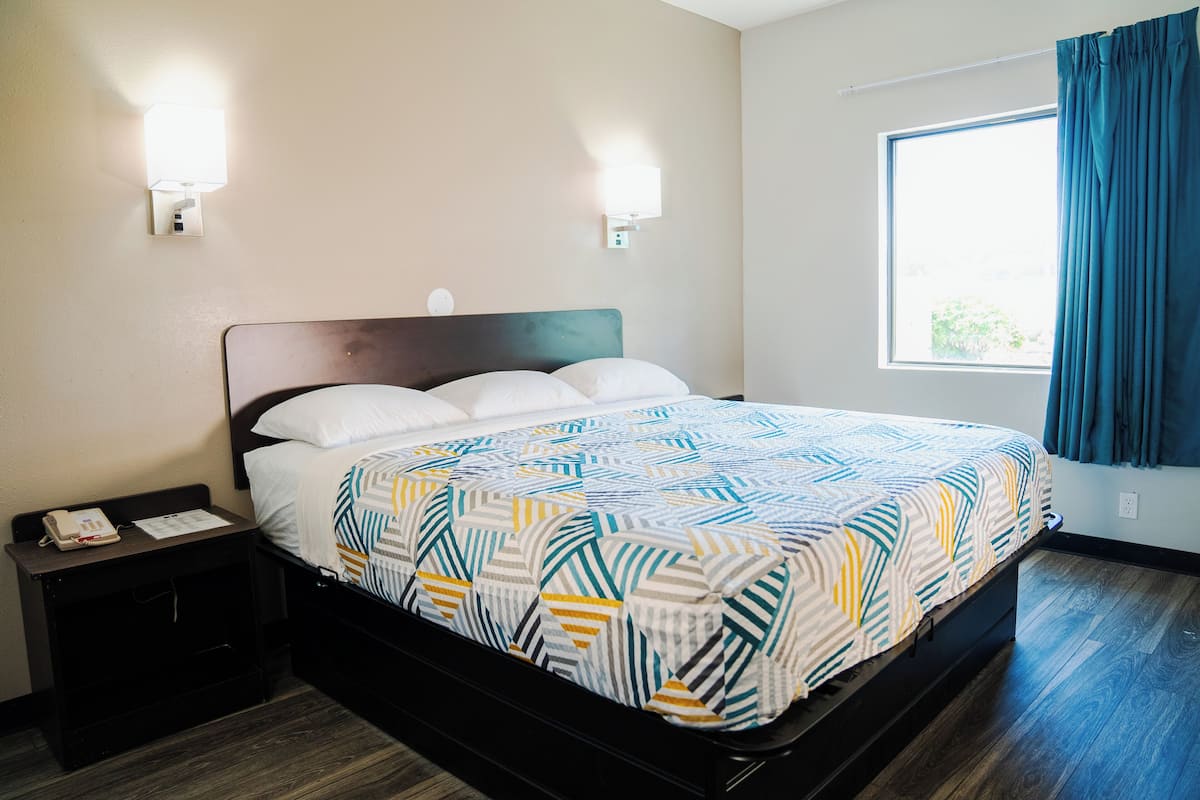 1 bedroom, desk, laptop workspace, bed sheets