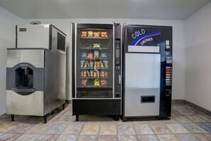 A commercial refrigerator with a beverage dispenser and a vending machine. - Rodeway Inn Red Bluff I-5 (Red Bluff)