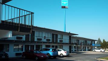 A motel with a blue sign indicating free WiFi.