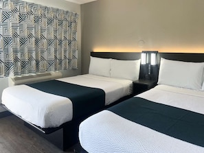 Escritorio, cortinas opacas, wifi gratis y ropa de cama