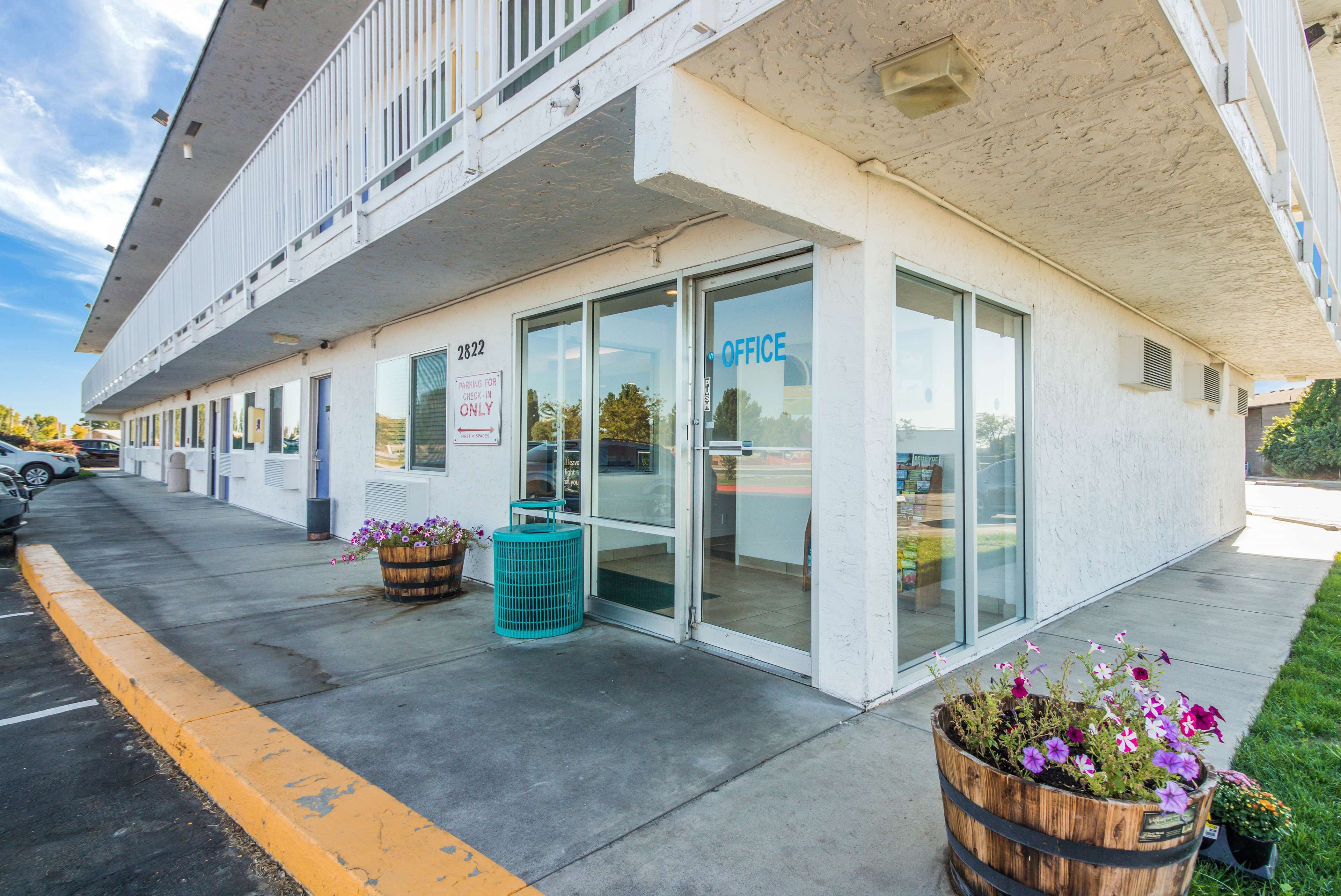 A building with a sign indicating "2822" and "OFFICE" on the front.
