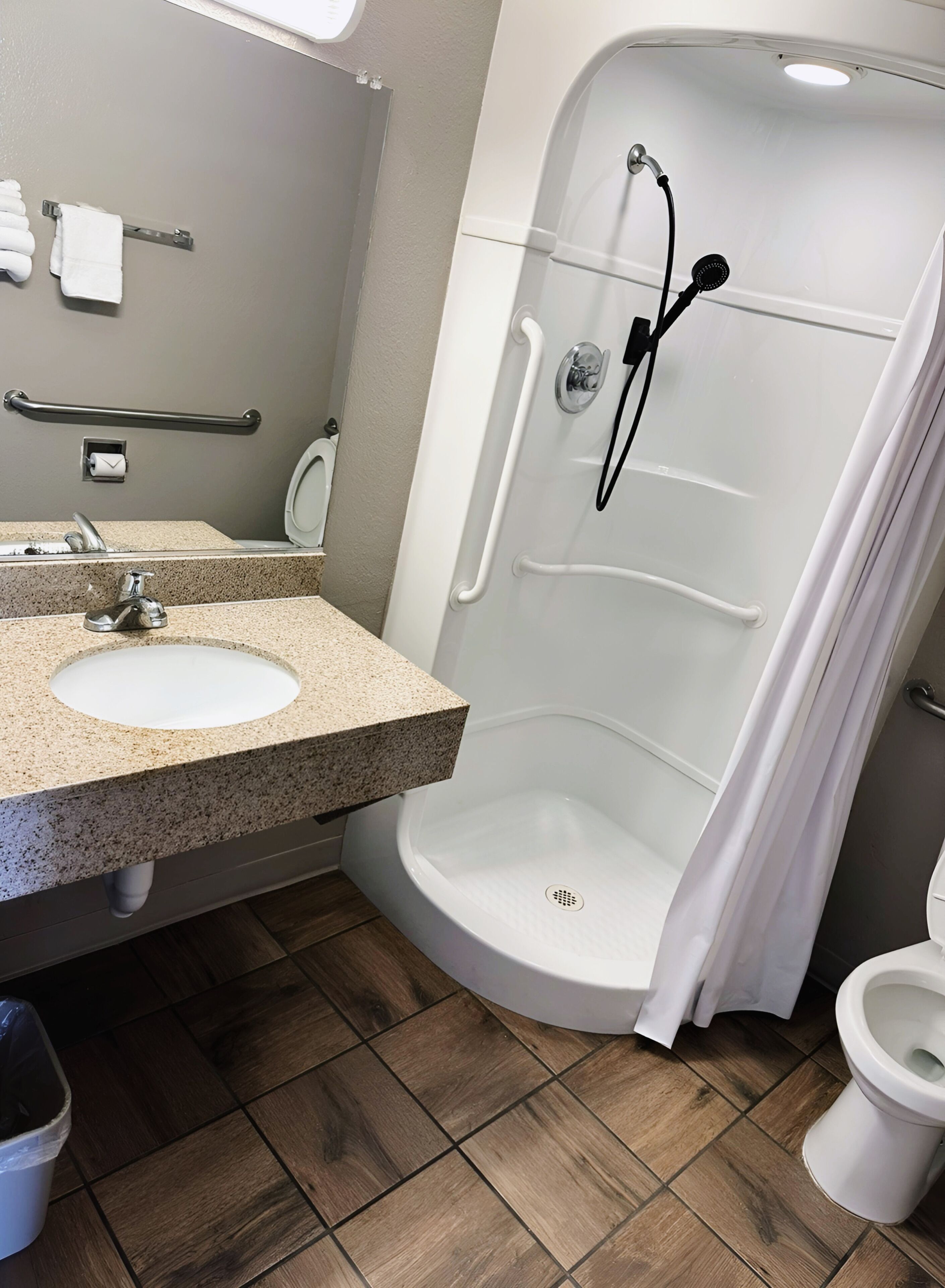 Shower, hair dryer, towels, shampoo