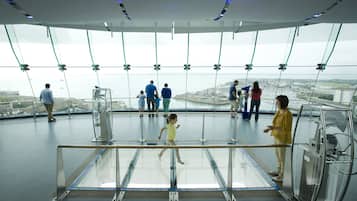 A glass observation deck with a clear view of the cityscape.