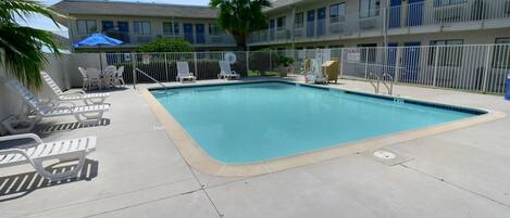 Outdoor pool, open 9:00 AM to 9:30 PM, pool umbrellas, sun loungers