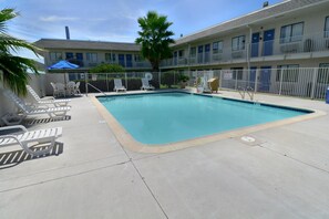 Outdoor pool, open 9:00 AM to 9:30 PM, pool umbrellas, sun loungers