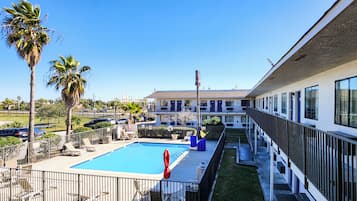 Outdoor pool, open 9:00 AM to 9:30 PM, pool umbrellas, sun loungers