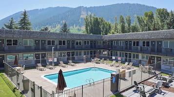 Seasonal outdoor pool, open 11:00 AM to 10:00 PM, pool umbrellas