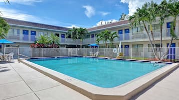 Outdoor pool, open 9:00 AM to 9:00 PM, pool umbrellas