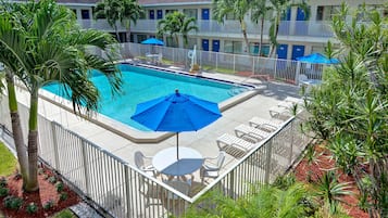 Outdoor pool, open 9:00 AM to 9:00 PM, pool umbrellas