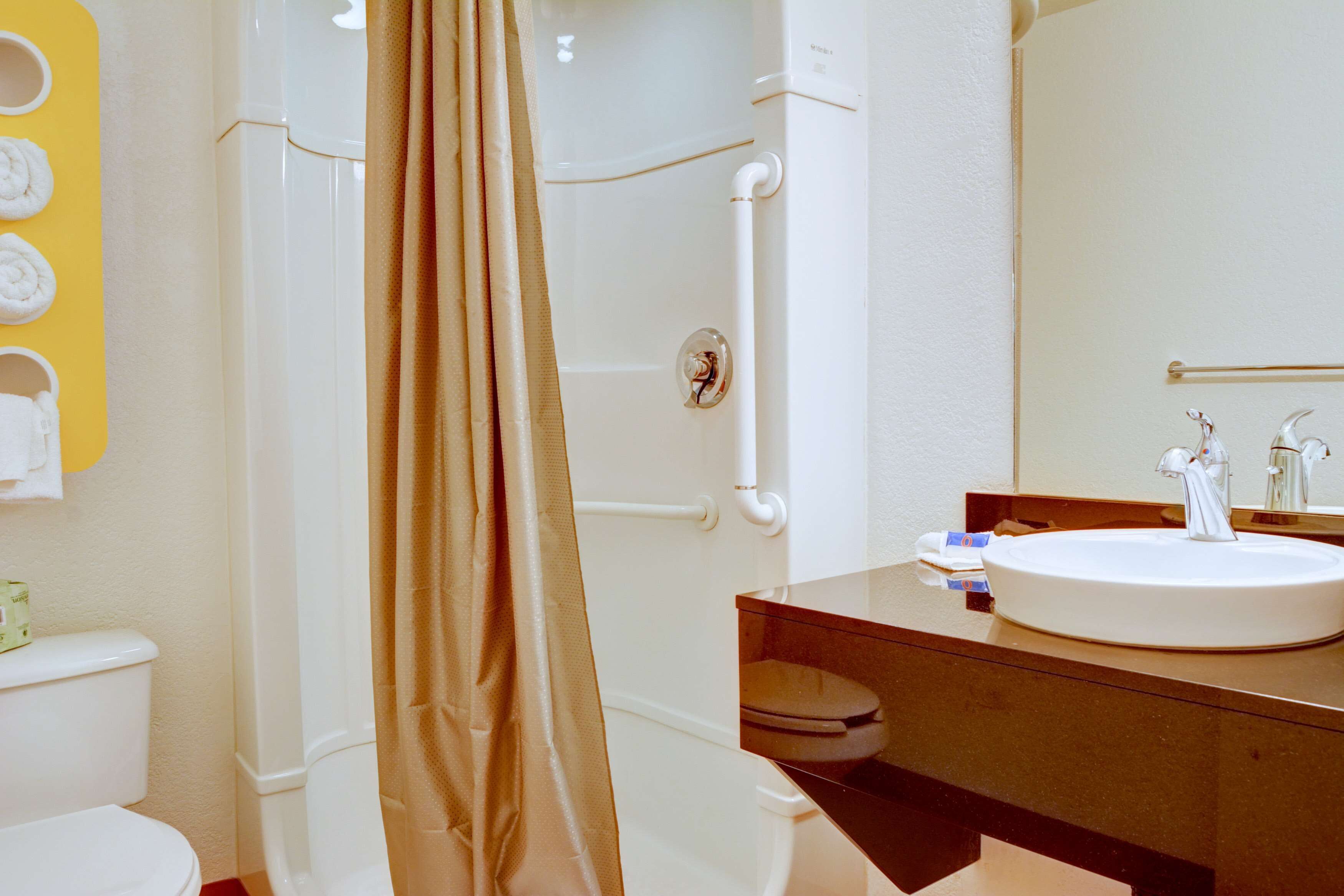 Combined shower/bathtub, towels, soap, toilet paper