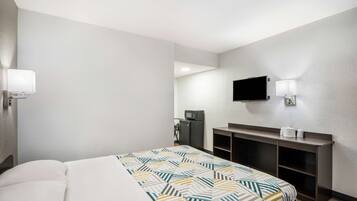 Desk, laptop workspace, bed sheets