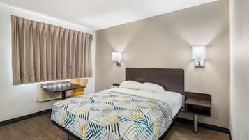 Desk, laptop workspace, bed sheets