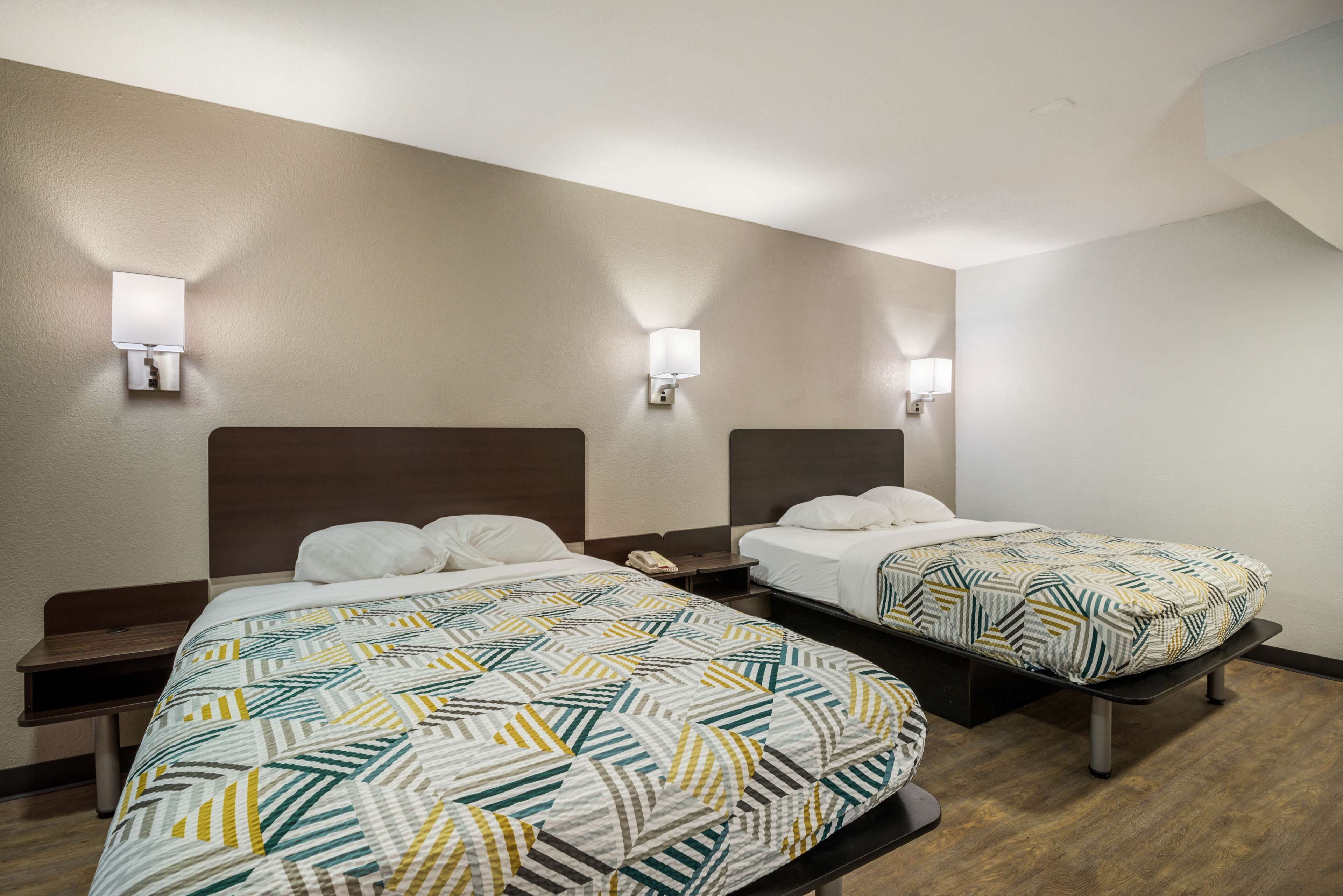 Desk, laptop workspace, bed sheets