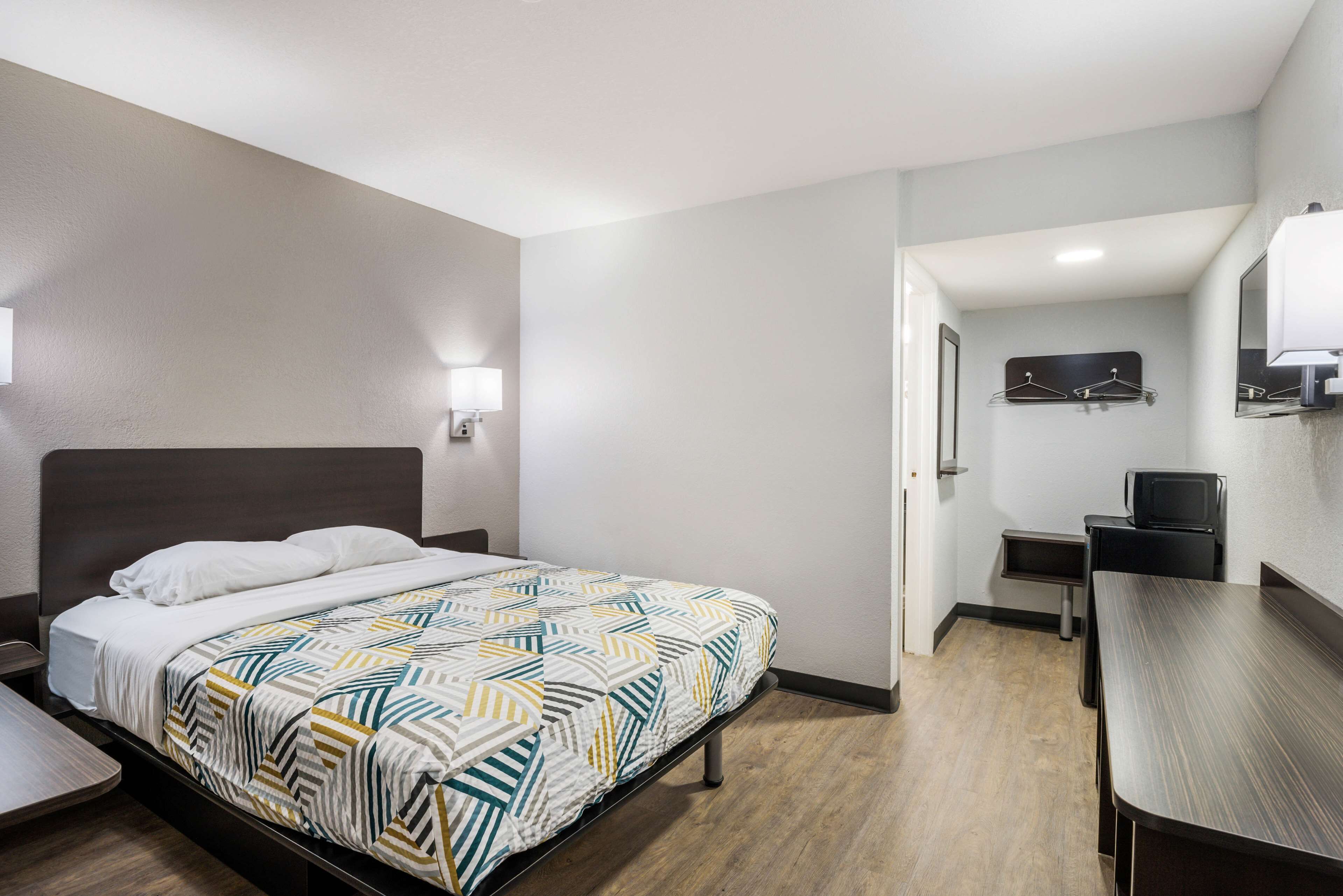 Desk, laptop workspace, bed sheets