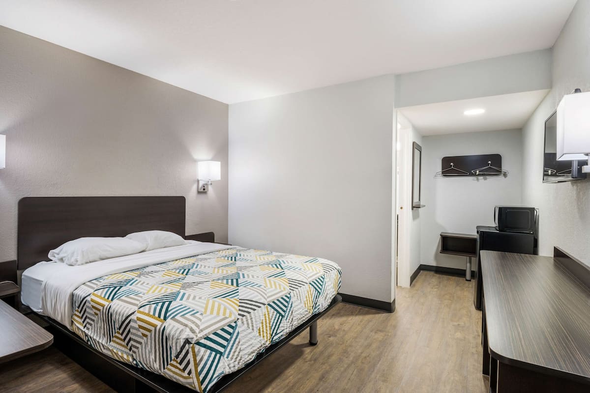 Desk, laptop workspace, bed sheets