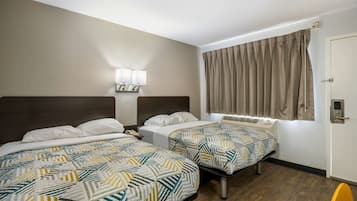 Desk, laptop workspace, bed sheets