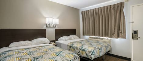 Desk, laptop workspace, bed sheets