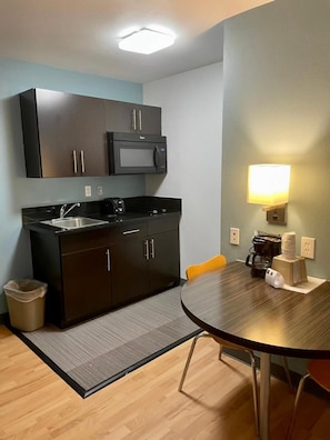 Fridge, microwave, stovetop, cookware/dishes/utensils