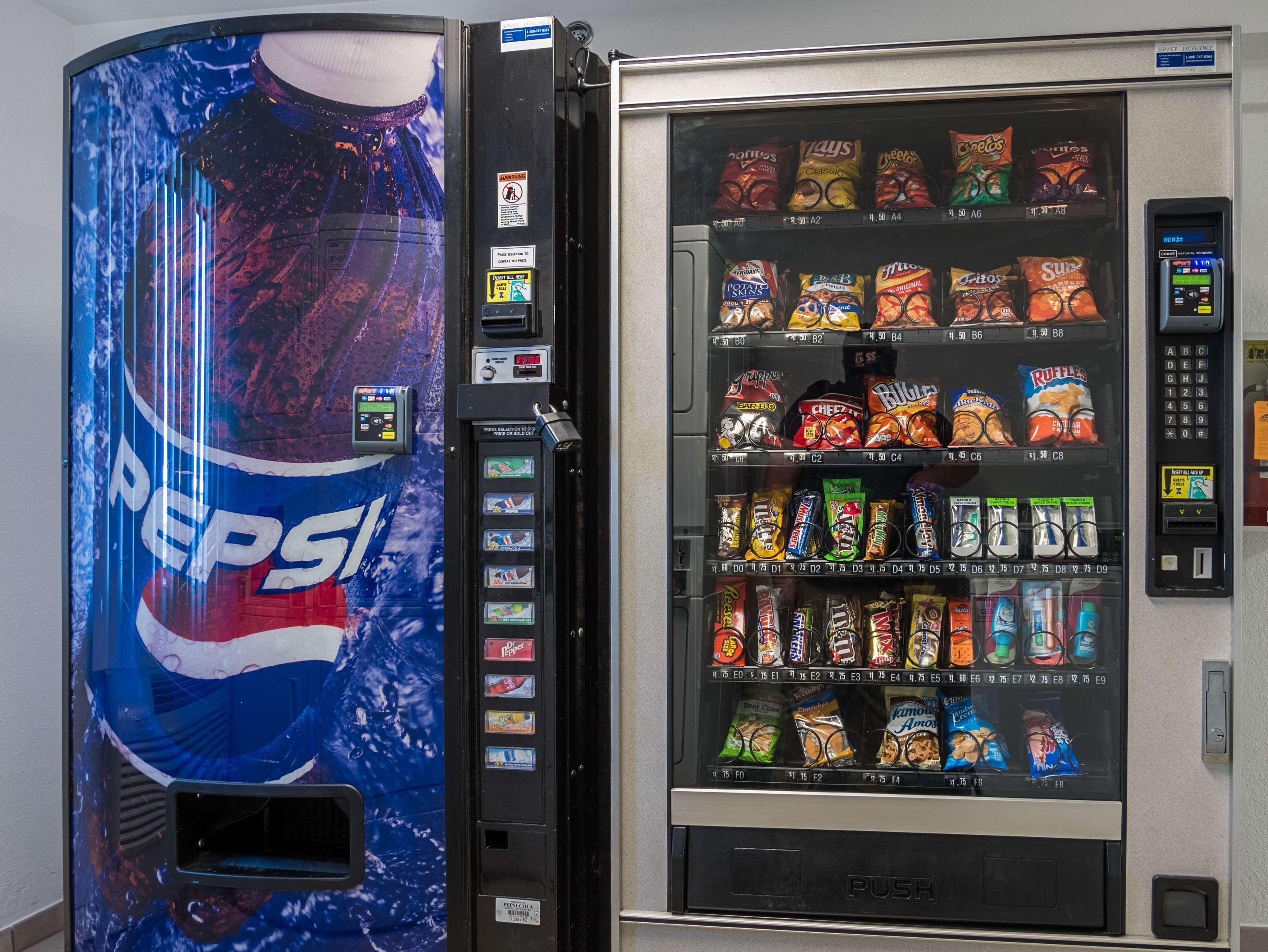 A vending machine with a Pepsi advertisement and various snacks and drinks.