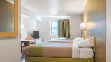 Desk, bed sheets, alarm clocks