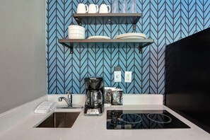 Full-sized fridge, microwave, coffee/tea maker, cookware/dishes/utensils