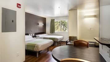 Desk, iron/ironing board, bed sheets, alarm clocks