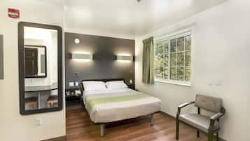 Desk, iron/ironing board, bed sheets, alarm clocks