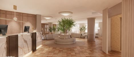 A modern lobby with a reception desk, seating area, and a large tree.
