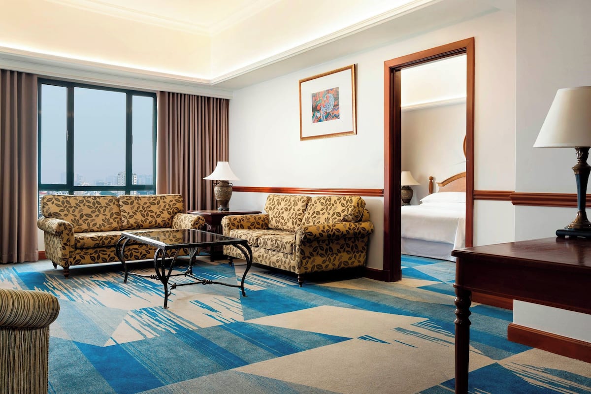 Executive Suite, 1 Bedroom, Non Smoking | Living room | 37-inch TV with cable channels, fireplace, foosball