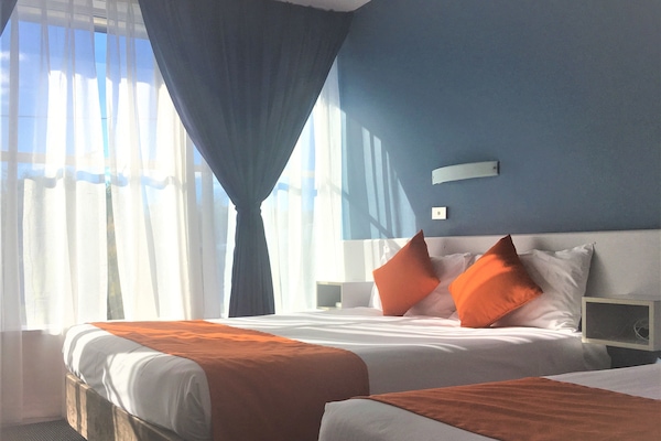 Standard Room | 1 bedroom, individually furnished, laptop workspace, iron/ironing board