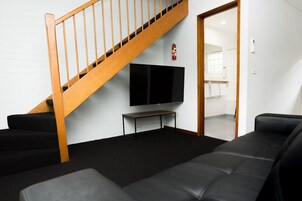 Standard Two Bedroom Apartment (Multi-Level) | Living area | Flat-screen TV