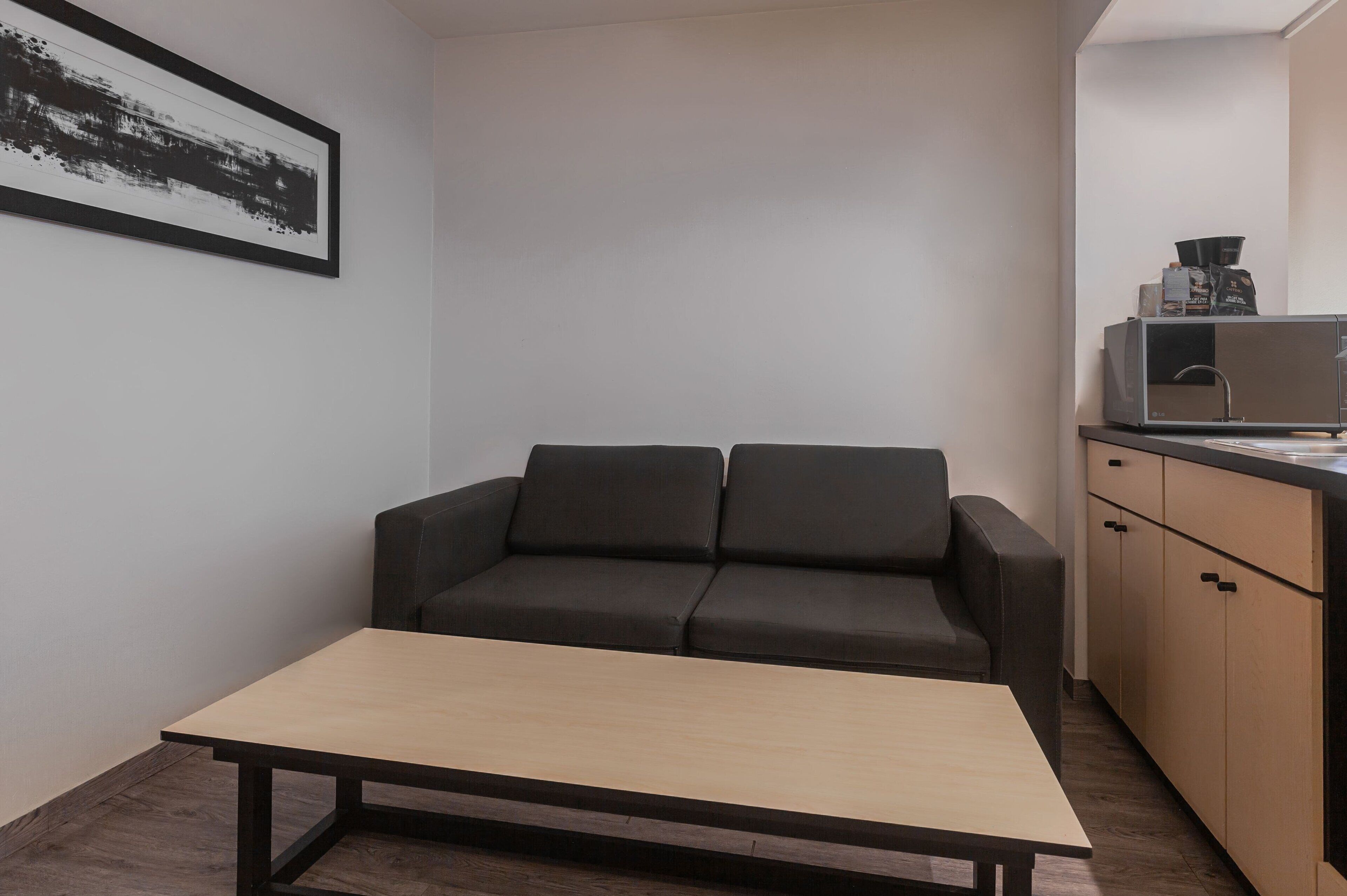 suite, 1 queen bed with sofa bed, non smoking | down duvets, desk, soundproofing, iron/ironing board