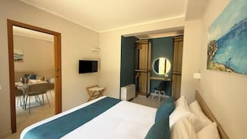 Suite | Lenzuola Frette, minibar, una cassaforte in camera, una scrivania