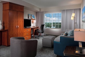Suite, 1 King Bed with Sofa bed | Living area | 43-inch flat-screen TV with satellite channels, TV, pay movies