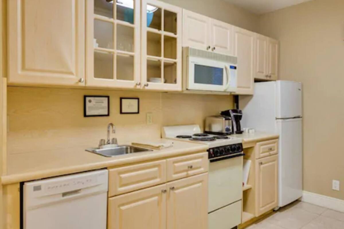 full-sized fridge, microwave, stovetop, dishwasher