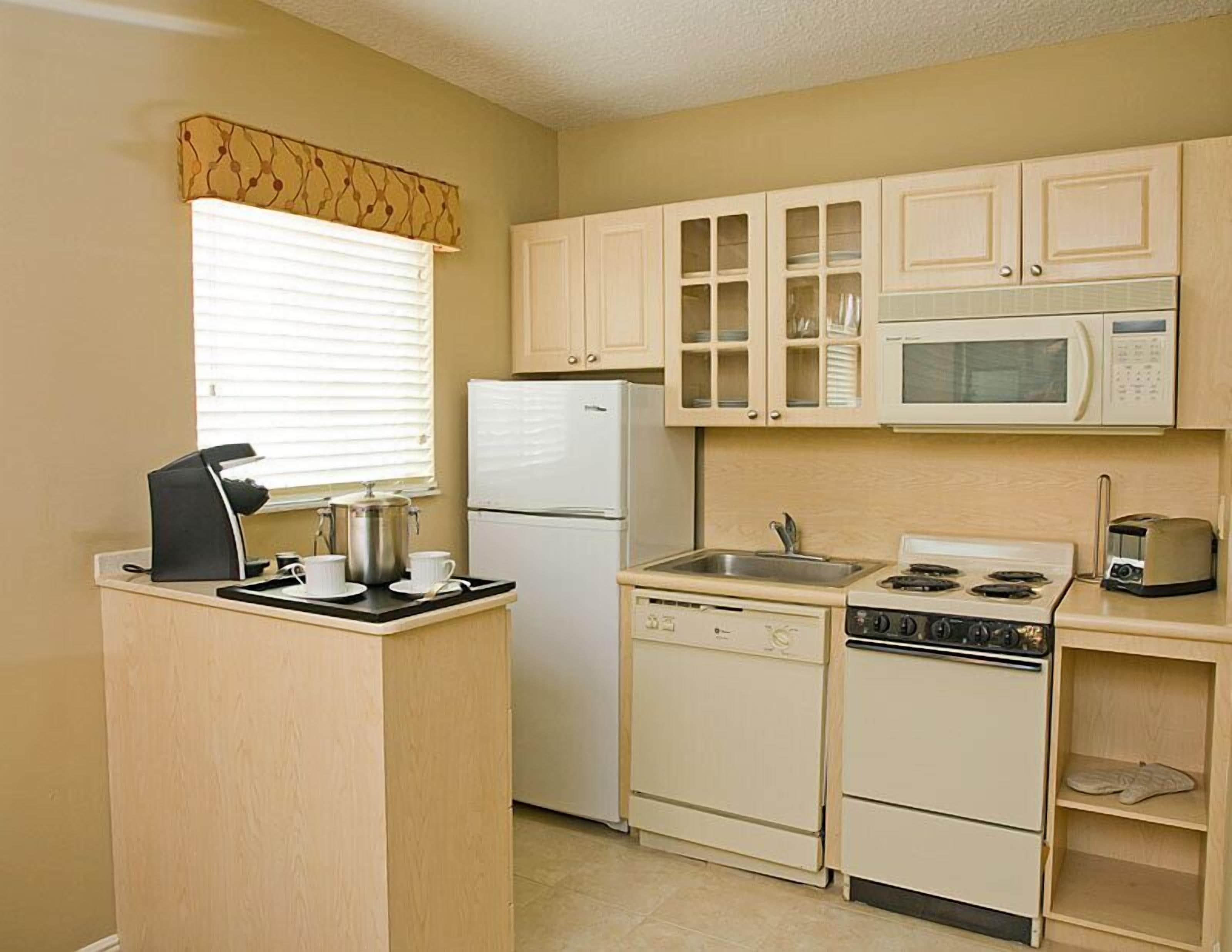 full-sized fridge, microwave, stovetop, dishwasher